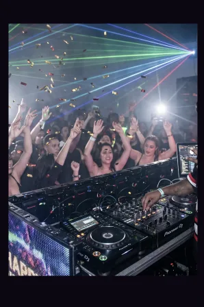 DJ 710 live in the booth with a packed dance floor